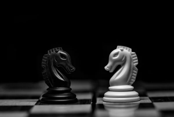 white ceramic figurine on black table