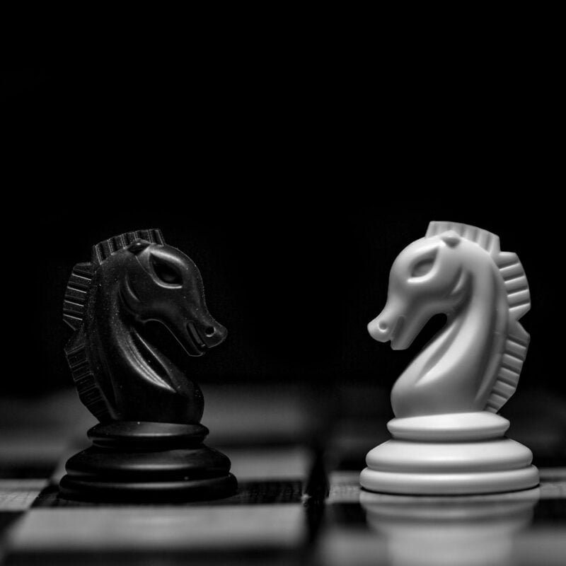 white ceramic figurine on black table