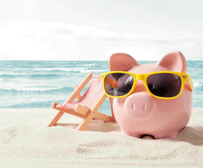 Piggy bank resting on vacation. Saving money, travel concept