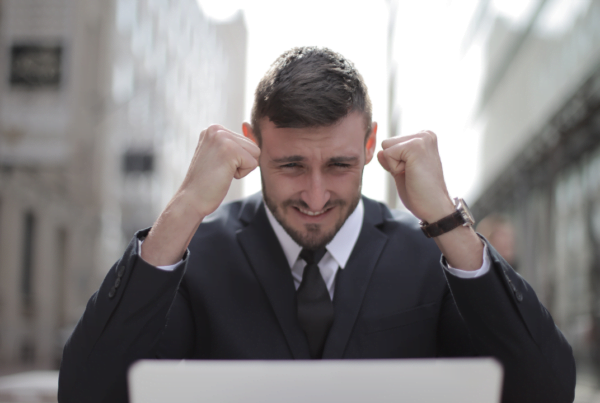 Man in Black Suit Achieved an Accomplishment