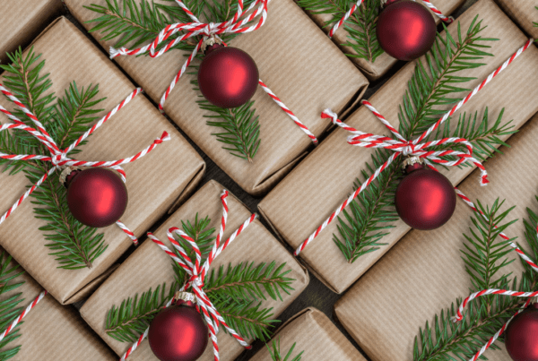 Christmas gifts. Gifts wrapped in brown paper. Christmas gift wrapping concept.