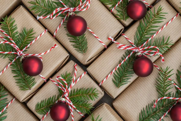 Christmas gifts. Gifts wrapped in brown paper. Christmas gift wrapping concept.