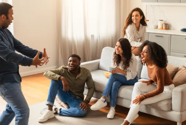 An animated storytelling session among a group of multiracial, young friends with varied reactions at home.