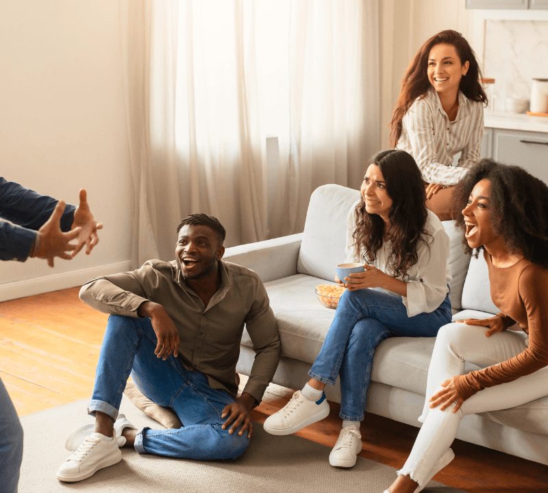 An animated storytelling session among a group of multiracial, young friends with varied reactions at home.