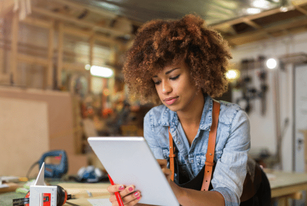 Afro American woman craftswoman working in her workshop