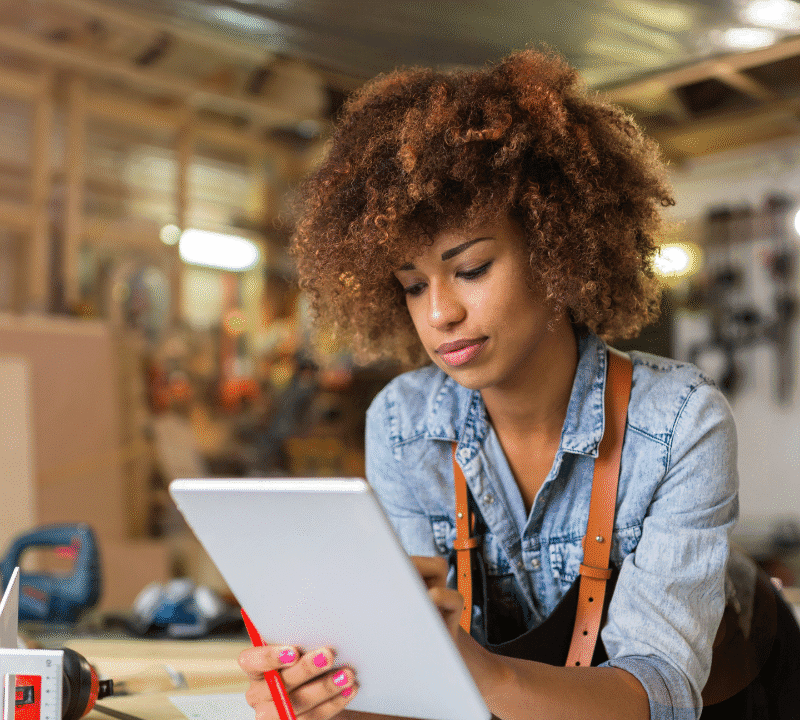 Afro American woman craftswoman working in her workshop