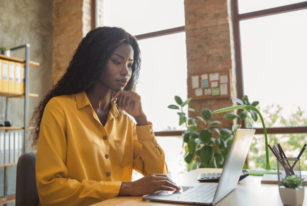 profile side photo of afro american woman work office laptop serious executive workspace indoors in office.