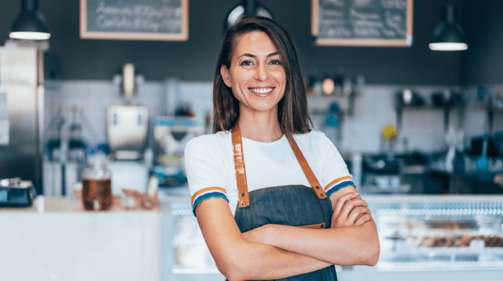portrait of a confident and happy female owner at a cafe.