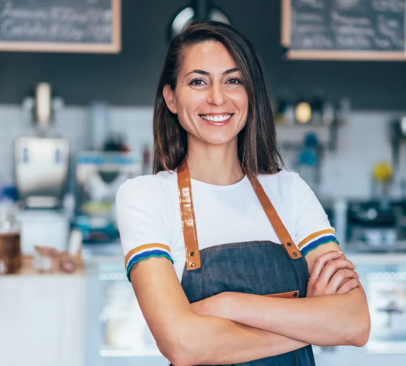portrait of a confident and happy female owner at a cafe.